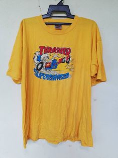 "Please read all description carefully before buying. If you have any questions feel free to ask. Vintage 90's Thrasher Supercharged Skateboard T-shirt Colour : Yellow Size on tag : XL Brand : Oneita Condition : Good condition. MEASUREMENT Armpit to armpit : 24\" Shoulder to bottom hem : 28.5\" PLEASE CHECK ACTUAL SIZE CAREFULLY, NO RETURNS OR COMPLAINT FOR WRONG SIZE ACTUAL. ACCEPT PAYPAL ONLY. Shipping cost is $18 for economy or $28 DHL Express wordwide shipping. Transit time can take 2-3 week Surf Streetwear, Powell Peralta, Skateboard Tshirt, Hip Hop Shirts, Trendy Tee, Tour T Shirts, Stylish Shirts, Classic Shirt, Skateboarding