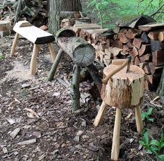 several pieces of wood stacked on top of each other in the woods next to trees