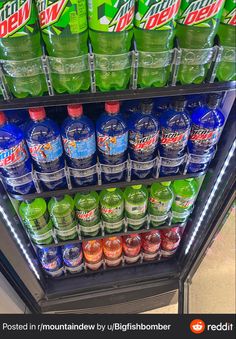 a refrigerator filled with lots of bottled water