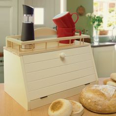 bread is sitting on the counter next to an oven and other kitchen items in front of it