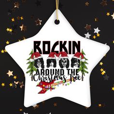 a white star ornament with the words rockin'pop around the christmas tree