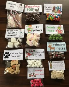 many different types of candies are on the table with labels for each type of candy