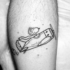 a black and white photo of a man's leg with a drawing on it