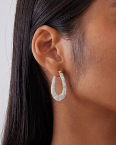 This is a mid-sized hoop earring set with over 300 pcs of micro pavé crystals. The design is elegant, sophisticated and a lot of sparkle and bling. The earring uses the crystal luster setting technique which creates lusters that shines and sparkles. This earring is made in 18K yellow gold or white gold plated over 925 sterling silver. Each piece is hand polished to perfection. Closure: Hoop Stamp Approx. Measurement: Outer Length: 1.4 inches Outer Width: 35 inches Silver Weight: Approx. 0.18 oz Dazzling Cubic Zirconia Hoop Earrings With Rhinestones, Glamorous Crystal Rhinestone Hoop Earrings, Glamorous Rhinestone Crystal Hoop Earrings, Small Hoop Earrings With Rhinestones In Cubic Zirconia, Elegant Crystal Hoop Earrings, Elegant Rhinestone Hoop Crystal Earrings, Elegant Cubic Zirconia Hoop Earrings With Bling, Hoop Earrings With Rhinestones And Cubic Zirconia, Glamorous Diamond Hoop Earrings With Sparkling Stones