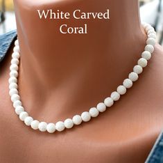 Add an elegant touch to your bridal ensemble with this stunning White Carved Coral Necklace. Crafted with 8mm white carved coral beads, this necklace exudes timeless beauty and sophistication. Perfect for wedding accessories or any special occasion, this coral bead necklace is sure to make you stand out. Handmade with care and finished with a durable steel wire and clasp, it's a beautiful addition to any jewelry collection. --------------------------------------------------- Check out All Coral Pearl White 8mm Bead Necklace For Weddings, Elegant White Necklaces With 8mm Beads, Elegant White Necklace With 8mm Beads, Pearl White Necklace With 8mm Beads For Wedding, White Formal Necklaces With 8mm Beads, White Necklaces With 8mm Beads For Formal Occasions, Formal White Necklace With 8mm Beads, Pearl White 8mm Beads Necklace For Weddings, White Gemstone Bead Necklaces For Weddings