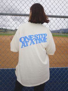 Nightbirde Walking Club t-shirt. With front, back & sleeve puff print details. Back says "one step at a time" and sleeve has the nightbirde logo. Unisex super soft vintage style ivory tee. Models are 5'8 and wearing a size 2XL & XL. All proceeds go to Nightbirde Foundation. Learn more about the Nightbirde Foundation. Vintage Cream Short Sleeve T-shirt, Cream Vintage T-shirt With Relaxed Fit, Cream Screen Print T-shirt For Streetwear, Vintage Short Sleeve Cream T-shirt, Vintage Cream Short-sleeved T-shirt, Cream Graphic Print Top For Streetwear, Vintage Cream Crew Neck T-shirt, Cream Text Print T-shirt For Streetwear, Cream T-shirt With Text Print For Streetwear