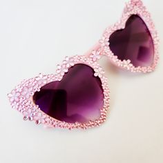 Look like a bad a$$ in these amazing floral heart shaped sunglasses. These glasses are perfect for the person that loves pink and flowers to wear at a garden party, bachelorette party, garden wedding or bridal shower. These will look stunning in engagement photos or wedding photos and are made with the vintage style pink rhinestones Not getting married? These are perfect to complete your music festival or concert look. Pair with your favorite summer dress. Each pair is hand embellished with the Heart-shaped Sunglasses With Heart Print For Party, Heart-shaped Party Sunglasses With Heart Print, Fun Party Sunglasses With Heart Print, Fun Heart Print Party Sunglasses, Cute Party Sunglasses With Heart Print, Purple Party Sunglasses, Heart-shaped Sunglasses For Summer Weddings, Cute Heart Print Sunglasses For Party, Valentine's Day Party Sunglasses With Gradient Lenses