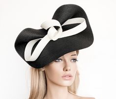 Elegant Black and White Kentucky derby hat for woman. This Black and White fascinate hat is embellished with a big bow. It is a perfect hat for weddings, Royal Ascot horse races, cocktails, derby... It is mounted on a headband. If you want, you can choose the side of the head were you like to wear the fascinator, just convo me. Any color of the fascinator can be changed to order. * PROCESSING TIME: 1 - 10 business days. * DELIVERY TIME (DHL Express): 1-4 business days to all countries Elegant Boater Hat With Bow And Curved Brim, Elegant Boater Hat With Curved Brim And Bow, Elegant Boater Hat With Curved Brim And Bow Detail, Royal Ascot Evening Top Hat, Elegant Boater Hat With Bow And Short Brim, Evening Hats With Bow And Short Brim, Black Bow Fascinator For Evening, Evening Hat With Bow For Royal Ascot, Elegant Black Fascinator With Bow