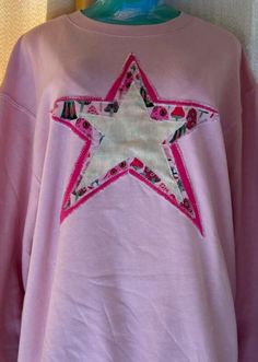 Pink Star Sweatshirt Cotton Long Sleeve Sweatshirt With Star Patch, Long Sleeve Cotton Top With Star Patch, Long Sleeve Cotton Tops With Star Patch, Cotton Long Sleeve Tops With Star Patch, Fall Cotton Sweatshirt With Star Patch, Winter Cotton Tops With Star Patch, Winter Cotton Top With Star Patch, Cotton Sweatshirt With Star Print And Relaxed Fit, Oversized Cotton Sweatshirt With Star Print