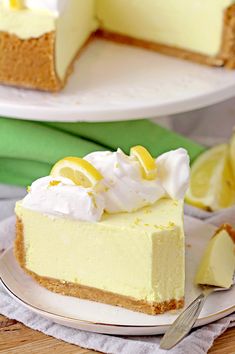 a slice of lemon cheesecake on a plate with a fork next to the pie