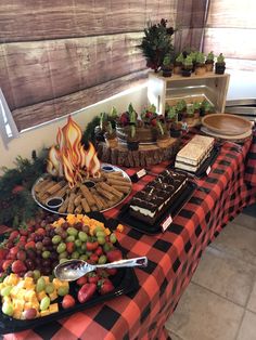 a buffet table filled with different types of food and desserts on it's sides