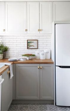 a white refrigerator freezer sitting inside of a kitchen