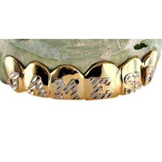 6 Teeth Diamond Cut Grill Gold Type 10K Gold Color Yellow Gold with White Rhodium Diamond Cuts Yes The price being displayed is for a 6 teeth top or bottom grill 4 solid and 2 open face teeth with diamond cuts in yellow gold. When placing your order please inform us of any customization request. We will contact you to discuss the pricing and confirm your order. Teeth Diamond, Bottom Grill, Diamond Teeth, Open Face, 10k Gold, Diamond Cut, Yellow Color, Gold Color, Diamond Cuts