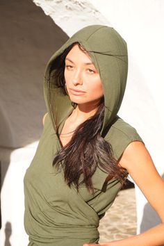 Versatile Boho Vest, Hooded Vest Top, Festival Wrap Vest wear sizes S to L- Model 182cm size  L Explore your unique style with this striking green vest - a fusion of asymmetry and versatility. Featuring an edgy asymmetrical design and a stylish hood, this vest is perfect for those who embrace alternative looks. Wear it in different ways to express your individuality, making it an ideal choice for festivals and beyond. Elevate your wardrobe with this standout piece that seamlessly blends fashion Festival Vest, Wrap Vest, Boho Vest, Handmade Leather Bracelets, Green Vest, Hooded Vest, Vest Outfits, Asymmetrical Design, Burning Man