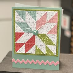 a close up of a small card with a clock on it's front end