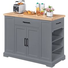 a gray kitchen island with two open shelves