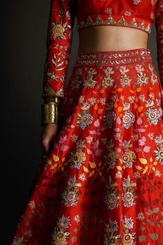 Red raw silk embroidered lehenga with attached cancan and sequin, thread work with embroidered border. Comes with embroidered padded blouse and dupatta.
Components:3
Pattern:Embroidery
Type of Work:Sequin,Thread work
Neckline:V Neck
Sleeve Type:Three quarter
Fabric:Raw Silk
Color:Red
Other Details:
Attached lining
Weight approx (in kg) : 10
Pocket on side
Note: The hand accessory worn by the model and the outfit worn by the model on the left is not for sale
Occasion:Bride,Wedding - Aza Fashions Floral Bridal Lehenga, Raw Silk Embroidery, Padded Blouse, Embroidered Lehenga, Hand Accessories, Embroidered Border, Pattern Embroidery, Red Sequin, Silk Embroidery