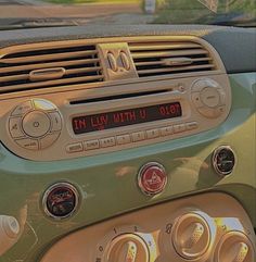 an old car dashboard with the radio and air vents on it's dash board