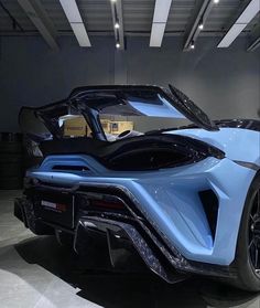 a blue sports car parked in a garage