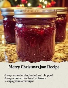 a jar filled with jam sitting on top of a counter next to a christmas tree