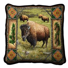 a decorative pillow with an image of a bison and other animals in the grass on it