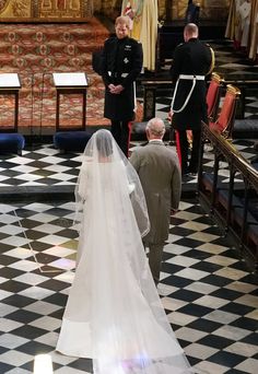 the bride and groom are walking down the aisle at their wedding ceremony in london, england