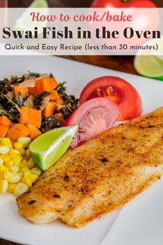 a white plate topped with fish and vegetables