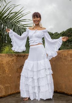 TOP: Bohemian 100% natural cotton blouse. Can be worn as off shoulders and cover shoulders 2 colors white and off white. Elastic around neckline and elastic waist trim with lace. Wide sleeve with layered unfinished hem. Double fabric in the front bust not in the back. Measurements: TOP Bust 32 up to 46 inches. Waist 22 stretch up to 42 inches. neckline 26 stretch up to 64 inches Sleeve 17 and 21 inches ( high low style) Length 15 inches. ---------------------------------------------------------- Bohemian Ruffled Sets For Spring, Fitted Bohemian Skirt With Ruffles, Fitted Cotton Sets With Ruffles, Fitted Bohemian Skirt With Attached Cancan, Fitted Peasant Style Festival Skirt, Bohemian Fitted Sets With Tiered Skirt, Summer Cotton Skirt With Attached Cancan, Fitted Peasant Skirt For Festival, White Cotton Skirt With Attached Cancan