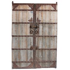 an old wooden door with iron bars on the front and side panels, isolated against a white background