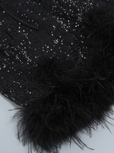 Color: Black Material: Polyester Feathers & sequins details Delicate dry clean Protect accessory before washing Cool iron Sample size S Our Style No. ZC_NIKA_B Black Sequin Fabric For Cocktail, Black Winter Dress With Contrast Sequin, Black Sequin Dress For Winter Party, Black Sequin Evening Dress For Winter, Black Glamorous Sequin Fabric For Formal Events, Black Glamorous Sequin Fabric For Formal Occasions, Glamorous Black Sequin Fabric For Formal Occasions, Black Embellished Sequin Fabric For Formal Occasions, Sequin Outfit