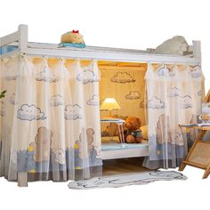 a child's bedroom with a canopy bed and teddy bear curtains on the walls