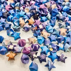 many different colored stars are scattered on the floor