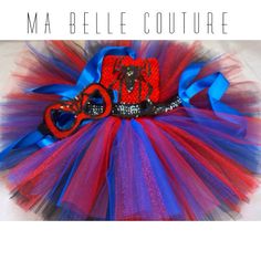 a red, white and blue tutu with scissors on it