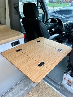 the interior of a vehicle with a table in the back