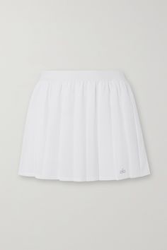 All of Alo Yoga's pieces are tested by the brand's in-house team to ensure they fit perfectly during your workout. This 'Varsity' tennis skirt is made from four-way stretch-jersey with classic pleats and an elasticated waistband. It's fitted with shorts underneath so you can move around easily on the court and has a handy hidden pocket. Casual Fitted Alo Yoga Tennis Skirt, Casual Fitted Tennis Skirt By Alo Yoga, White Athleisure Tennis Skirt For Sports, White Pleated Skirt In Athleisure Style, Sporty Pleated Tennis Skirt For Sports, White Athleisure Tennis Skort, Fitted Moisture-wicking Tennis Skirt, White Fitted Tennis Skirt For Athleisure, White Fitted Tennis Skirt Athleisure