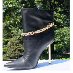 Features A Pointed Toe Paired With A Closed Back. An Ankle Chain Detail. Single Sole Styling And A Tall Metallic Heel. Man Made Materials. Approximate Heel Height 4 1/2 Inches. Ankle Chain, Metallic Heels, Bootie Boots, Heel Height, Ankle Boot, Ankle Boots, Chain, Heels, Boots