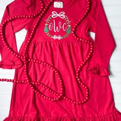 This embroidered frame featuring bows, Christmas trees, and an initial or monogram is perfect on a red dress for all the special Christmas occasions. I use embroidery thread on high quality blank dresses. To prolong the life of your appliqué, please wash inside out and lay flat to dry. Due to the personal nature of this design I do not accept returns. If you are unsatisfied in any way please reach out! Follow me on Instagram @olivia_tate_applique for new products and special preorder deals. Embroidered Holiday Dresses For Festive Occasions, Embroidered Dresses For Festive Holiday, Red Embroidered Christmas Dress, Winter Embroidered Red Dresses, Red Embroidered Dress For Christmas, Red Embroidered Winter Dress, Holiday Red Embroidered Dress, Christmas Dress Green, Green Christmas Dress