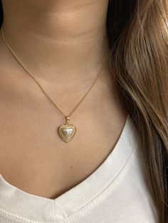 "18 Karat Gold Filled Pearl Heart Charm Necklace The perfect addition to layering with other 14\" or 16\" inch dainty gold chains. An elegant, simple piece that transitions well for daily wear. Material: 18 Karat Gold Filled, Hypoallergenic, Tarnish Resistant. Pendant Size: 17mm x 18mm (without bail) Chain Length: 18 inches Proper Care for your new MaLiBeads: Gold Filled products are durable; however, please remember to apply beauty products such as perfume, hairspray or deodorant before wearing Gold Heart Necklace With Pearl Charm As Gift, Gold Pearl Necklace With Heart Charm And Pendant, Silver Heart-shaped Pearl Necklace, Heart Necklace With Pearl Chain For Gift, Gold Pearl Necklace With Heart Pendant And Beads, Anniversary Heart Pendant Pearl Necklace, Silver Heart Pendant Pearl Necklace As Gift, Gold Heart-shaped Pearl Pendant Necklace, Silver Heart Pendant Pearl Necklace For Valentine's Day