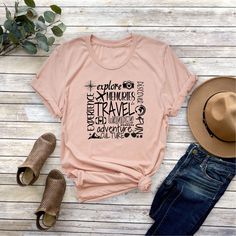 Travel Word Collage Shirt, Traveler Gift, Travel Tee, Vacation Tee, Explore the World Shirt, Globetrotter Tee, Vacay Mode Shirt, Holiday Tee NOTE: We use black design for White, Light Grey Heather( Athletic Heather), Pink, Heather Peach, Mint Green, Burnt Orange colors. For other colors we will use white design. Hello! First of all thank you for being here and checking out our finest t-shirt designs. As Mudo Boutique, we dedicated ourselves to provide the best possible service for our valuable c Graphic Tee With Letter Print For Travel, Graphic Print Short Sleeve T-shirt For Travel, Cotton Letter Print Travel Tops, Cotton Travel Tops With Letter Print, Cotton Letter Print Tops For Travel, Graphic Tee With Crew Neck For Travel, Casual Graphic Print Travel Shirt, Short Sleeve Tops With Letter Print For Travel, Cotton Short Sleeve T-shirt For Travel