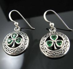 Genuine .925 Polished and Antiqued Sterling Silver Celtic Knot and Emerald Green Shamrock Earrings! This well-crafted pair of Celtic Trinity Knot earrings is highly polished for great reflection and boasts beautiful emerald green faceted shamrock leaves that dazzle the eye. These earrings are always a big hit on St. Patrick's Day and compliment any women's wardrobe with an extra touch of femininity and style.A popular symbol with deep roots and rich in heritage, the Celtic Knot is an inspiration Classic Sterling Silver May Birthstone Earrings, Celtic Knot Bracelet, Shamrock Earrings, Celtic Trinity Knot, Celtic Earrings, Green Shamrock, Trinity Knot, Irish Jewelry, Celtic Rings