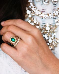 a close up of a person wearing a ring