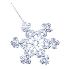 a crocheted snowflake ornament on a white background