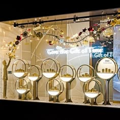 a window display with lights and ornaments in it