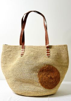 Handwoven from sun-kissed raffia fibers, this chic accessory boasts timeless appeal. Whether you're exploring the city or attending a garden soirée, this handbag combines practicality with natural elegance. 🌿 Features: Lined Interior: Keep your essentials organized. Secure Zipper Top: Safely store your belongings. Leather Handles: A touch of sophistication. 📏 Approximate Dimensions (may vary slightly): Length (L): 16 inches Width (W): 11 inches Thickness (T): 4 1/2 inches 🌟 Lightweight at ~1. Summer Lovin, Chic Accessories, Zipper Top, Circle Design, Summer Accessories, Leather Handles, Sun Kissed, Perfect Summer, Leather Handle