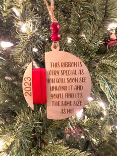 a christmas ornament hanging from a tree with the message, this region is very special as you will soon see around it