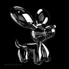 a black and white photo of a balloon dog