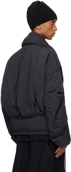 RDS-certified down-filled and lightweight nylon taffeta jacket. Water-repellent. · Shawl collar · Magnetic fastening at double-breasted press-stud closure · Welt pockets · Drawstring at hem · Dropped shoulders · Elasticized cuffs · Welt pocket at interior · Full recycled polyester sateen lining Supplier color: Black cloud Fill: 90% white duck down, 10% feather. Nylon Outerwear With Padded Collar For Streetwear, Streetwear Nylon Outerwear With Padded Collar, Urban Nylon Windbreaker With Padded Collar, Nylon Outerwear With Padded Collar For Cold Weather, Nylon Techwear Outerwear With Ribbed Cuffs, Cold Weather Nylon Outerwear With Padded Collar, Black Nylon Outerwear With Elastic Cuffs, Techwear Outerwear With Padded Collar In Nylon, Winter Windbreaker With Padded Collar