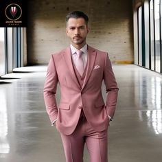 a man in a pink suit standing with his hands on his hips and looking at the camera