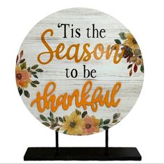 a wooden sign that says tis the season to be grateful with flowers and leaves on it