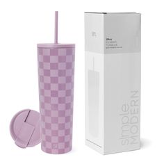 a pink tumbler cup next to a box with a straw in it and the lid open